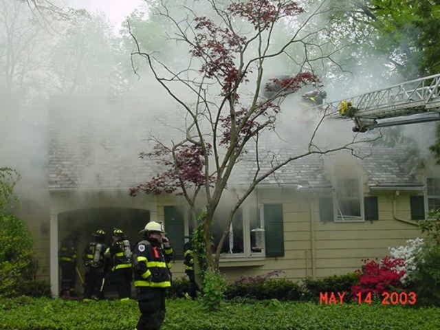 The 9-2-4 crew vents the roof on Stafford Avenue May 14, 2003.